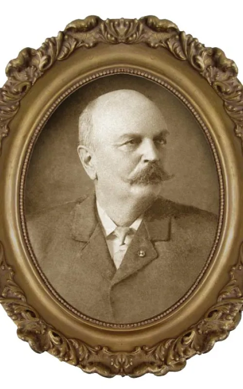 Sepia-toned portrait of a Mr. Goodyear in an ornate oval frame.